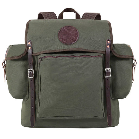 Rambler backpack in Olive Drab canvas with leather straps, rugged and handmade for durable outdoor use by Duluth Pack on hiking and camping trips.