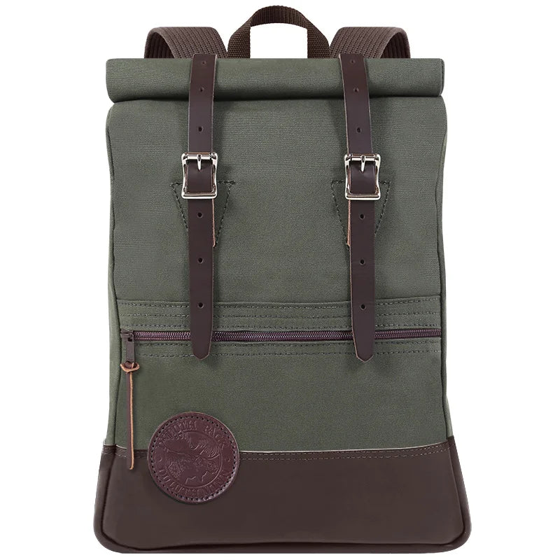 Deluxe Roll-Top Scout Pack in Olive Drab canvas and leather, handmade by Duluth Pack, designed for rugged outdoor use and secure, adjustable carrying.