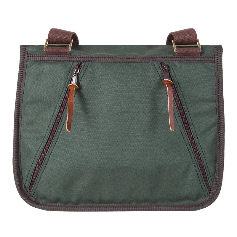 Conceal & Carry Field Satchel in rugged green canvas with leather zipper pulls, designed for durable outdoor use by Duluth Pack.