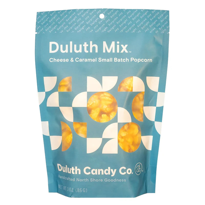 Duluth Candy Co. Popcorn Mix in Cheese & Carmel with a white background