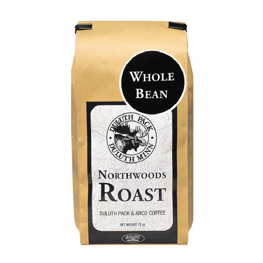 Duluth Pack Northwoods Roast whole bean coffee with black and white label featuring a moose logo and product details.