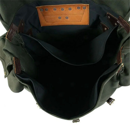 #3 Monarch Pack - 54 L featuring ultra burly 15-ounce canvas with leather accents, showcasing a spacious interior designed for rugged outdoor use.