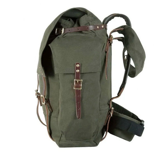 #4 Monarch Pack in burly green canvas with leather straps, designed for rugged outdoor use by Duluth Pack, shown in a traditional canoe pack style.