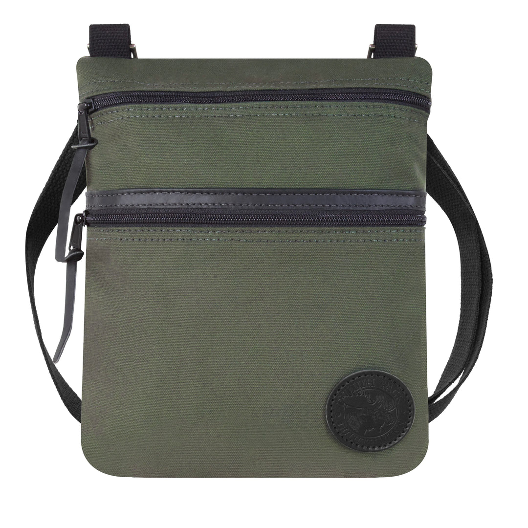 Traverse Crossbody Bag in Olive Drab with durable canvas and leather accents, featuring dual zippered compartments and adjustable shoulder strap for rugged outdoor use.